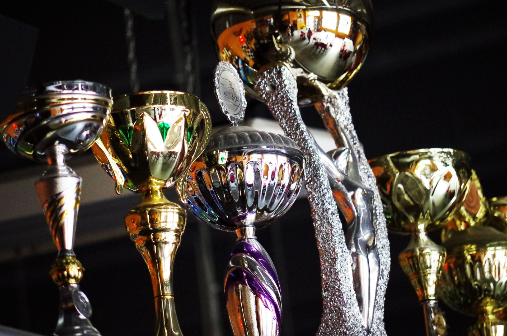 Photograph of metal trophies of various colors