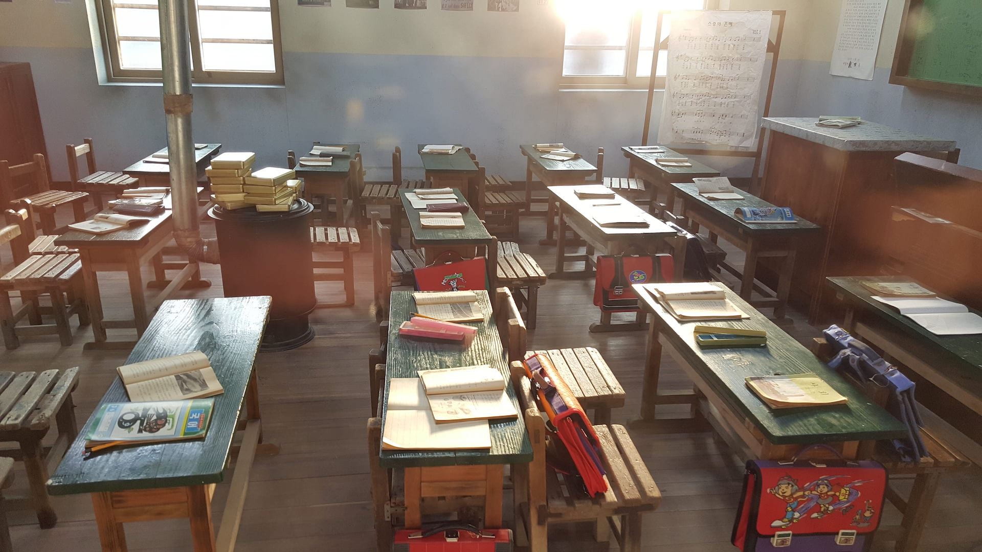 An elementary school classroom with tables and books